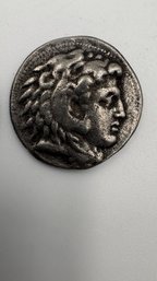 An Ancient Greek Silver Tetradrachm Coin From The Reign Of Alexander The Great.