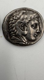 An Ancient Greek Silver Tetradrachm Coin From The Reign Of Alexander The Great.