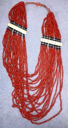 Red Beaded Necklace With Carved Bone