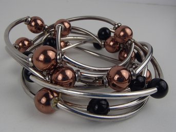 Eight Black And Copper Tone Stretch Bracelets