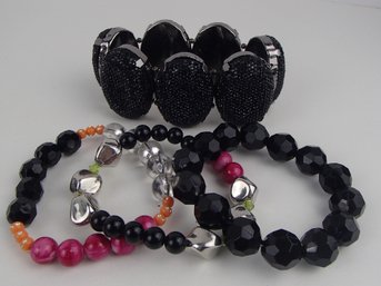 Four Stretch Bracelets Please See Photos