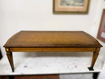 AN-28/ Vintage Wheeled Wood Coffee Table With Gold Edge Scrollwork