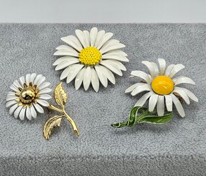 Lot 909LC - Daisies! Summer Fun! Three 1960s Enamel Daisy Flower Brooches