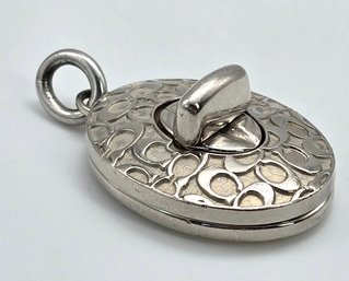Lot 985LC - Coach Costume Silver Pendant With Twist Turn Lock