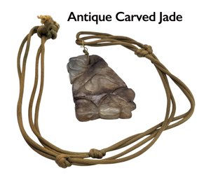 Lot 945WA - Antique Carved Grey-brown Jade Pendant On Cord