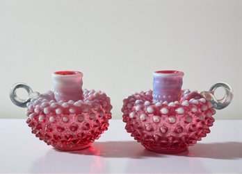 Lot 305 - Pair Of Fenton Cranberry Hobnail Opalescent Candlestick Holders - Mid Centur Art Glass - With Handle