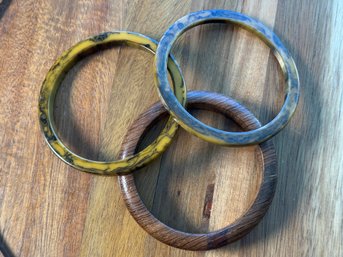 Lot 514LC - Three Bangles - 2 Vintage Marble Brown & Yellow Bakelite Bracelets - 1 Wood Bangle