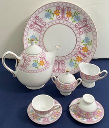 Lot 408 - Tea Party! Bone China Tea Set For Dolls - Tea Pot- Cups - Saucers - Creamer And Sugar
