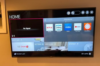 Lot 42- Nice! LG Smart 56 Inches TV  - Wall Mounted - Bring Tools To Remove From Wall