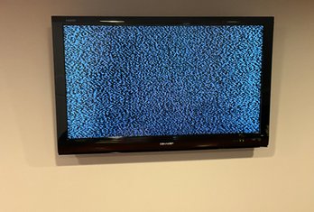 Lot 43- Sharp 40 Inch TV - Television Model LC-40E67UN - Wall Mounted - Includes Mount