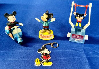 Lot 209 - 70s 80s Walt Disney Mickey Mouse Vintage Toy Lot - Scooter - Puppet - Trapeze - Key Chain