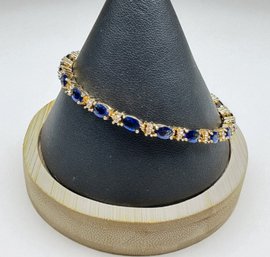 Lot 349LC - Costume Gold Tone Simulated Sapphire Blue & Clear Rhinestone Bracelet With Extender
