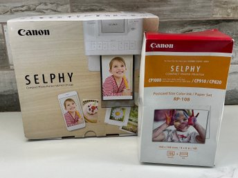 Lot 432 - Canon Selphy Compact Photo Printer CP1300 With Extra Postcard Size Color Ink & Paper - New In Box