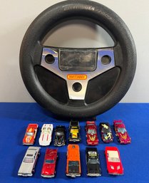 LOT 789 - 1970-80s 12 Die-cast Cars - Matchbox & Hotwheels In Steering Wheel Carry Case