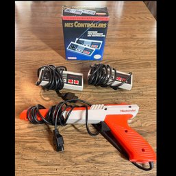 Lot 226- Nintendo Controllers Box Of 2 & Orange Zapper