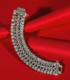 Lot 443 - Mid Century Silvertone Bracelet With Crystal Clear Rhinestones 4 Strand Link Chain