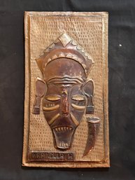 African Folk Art Hammered Copper Wall Plaque – Tribal Mask Relief, Signed "KAPINDULA"