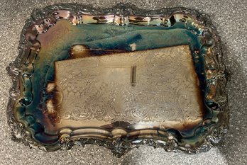 Silver Plated Serving Tray With An Ornate Raised Border And Etched Floral Center Design