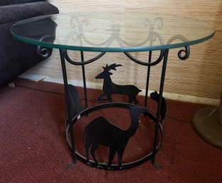 Glass-topped, Round Side Table Featuring A Black Metal Base With Cut-out Animal Silhouettes Made In India