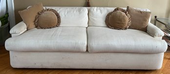 Classic Two-cushion Skirted Sofa Upholstered In An Cream Ribbed Fabric