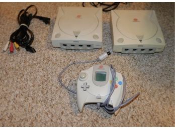Retro Pair Of Sega Dreamcast Video Game Consoles With Power Cord, AV Cables And Controller