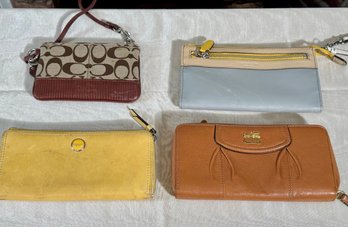 Four Coach Wallets