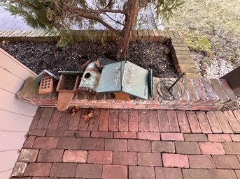 Lot Of Bird Feeders And Houses