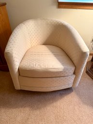 Cream-colored Upholstered Swivel Barrel Chair