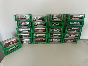 NIB Lot Of 22 Miniature Hess Trucks