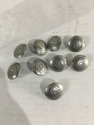 Lot 66- Nine Stamped Indian Buttons