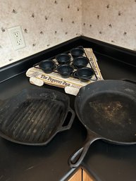 Lot 59-two Lodge Cast Iron Pans And A Popover Pan
