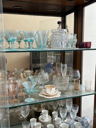 Lot 93-contents Of Curio Cabinet. Blue Depression Glass, Pink And Miscellaneous Glass