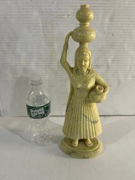 Lot 58- Carved Figure Of Woman Carrying Pots. A Traditional Motif