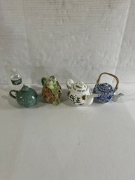Lot 89- 4 Decorative Teapots. The One With Flowers Is Botanical Garden Collection