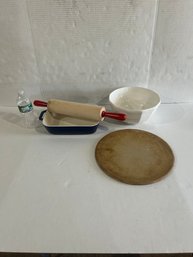 Lot 103- Kitchen Lot! Staub Pan, King Arthur Flour Rolling Pin, Pampered Chef Pizza Stone And Bowl