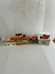 Lot 155- Four CVPS Collector Coin Bank Die Cast Trucks