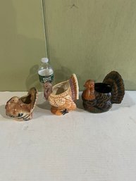 Lot 208- Three Turkey Candle Holders