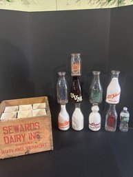 Lot 224- Seward Dairy Wooden Crate And 9 Milk Bottles
