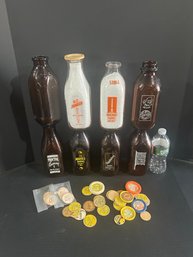 Lot 225- Eight Milk Bottles And Bottle Tops