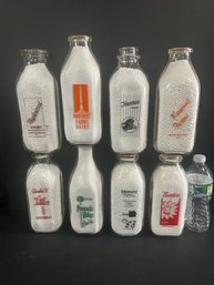 Lot 226- Eight Milk Bottles
