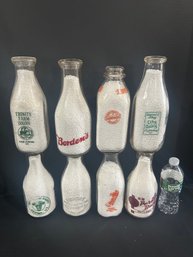 Lot 231- 8 Milk Bottles