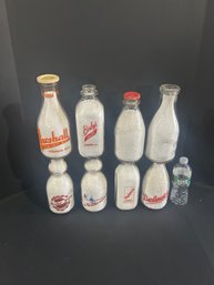 Lot 232- Eight Milk Bottles