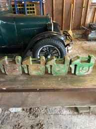 Lot 308- Four Tractor Suitcase Weights. One Is John Deere