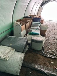 Lot 319- Numerous Miscellaneous Tent Parts And Pieces. Metal Framing And Tarps