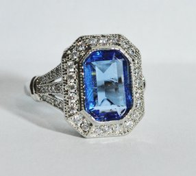 Beautiful  Emerald Cut Sapphire CZ  In Sterling Silver-plated Basket Setting Ring  Size 7.5  (US Sizing)