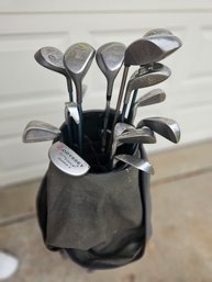 Older Golf Bag With Variety Of Clubs And Two Covers