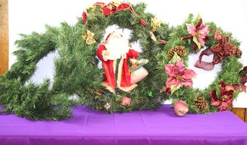 Three Christmas Wreaths, One With Santa