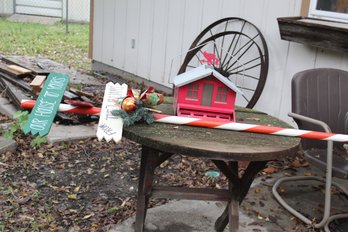 Christmas Pole Sign And Red Bird Feeder