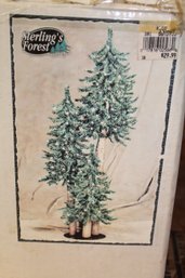 Three Small Christmas Trees On A Pole