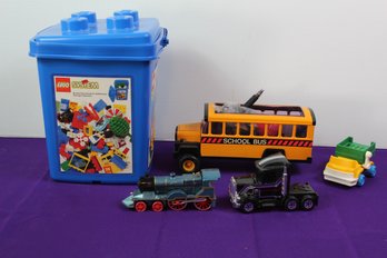 Partial Box Of Legos, Toy Bus, Train, Truck